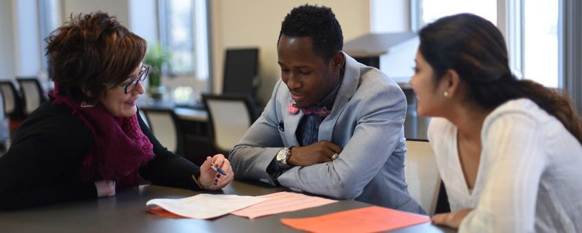 Delaware Tech employees doing paperwork